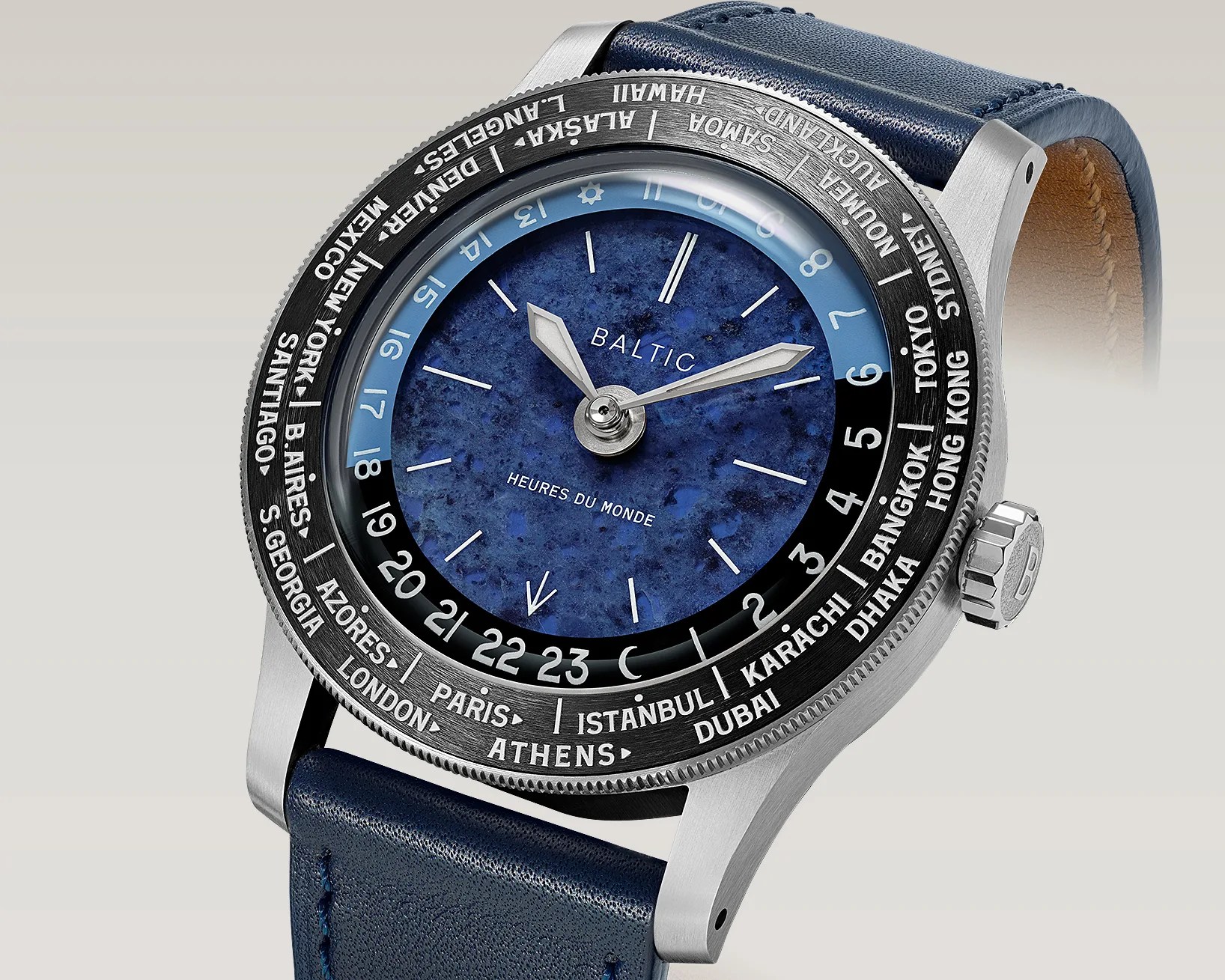Silver Baltic wristwatch with a blue marbled dial, world cities on the bezel, and a blue leather strap.