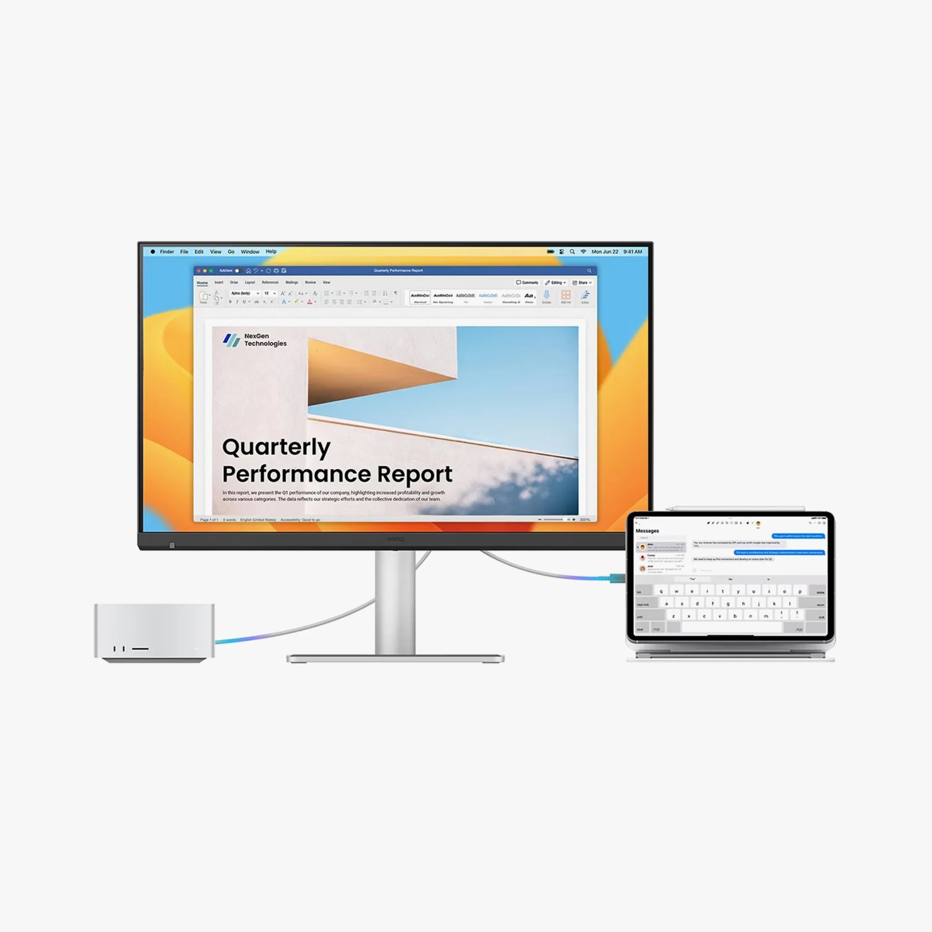 Silver desktop computer connected to a large monitor displaying a quarterly performance report and a tablet showing messages.
