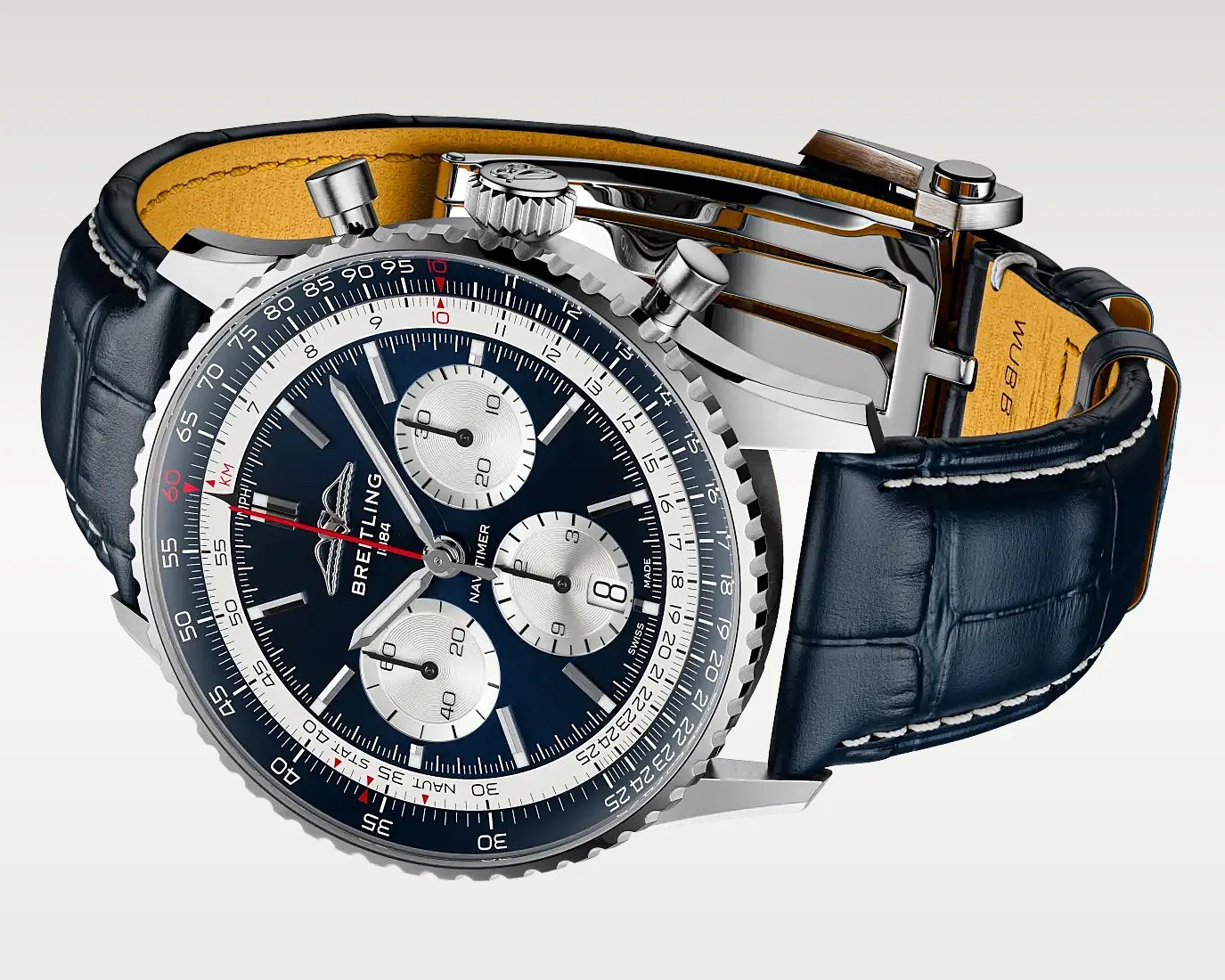 Breitling Navitimer watch with blue dial, three silver subdials, stainless steel case, and blue leather strap with white stitching.