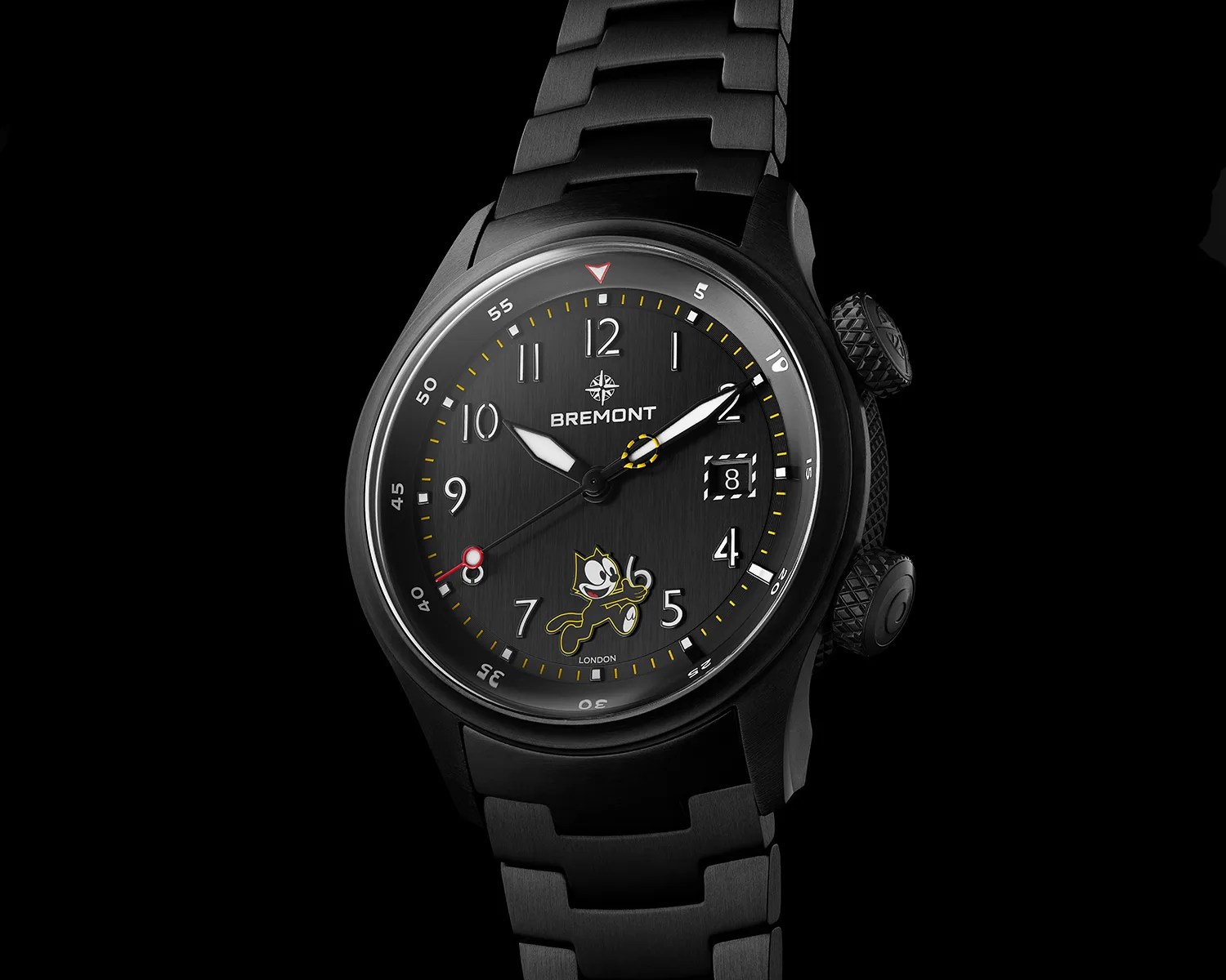 Black Bremont wristwatch with metal link bracelet, white numerals, yellow accents, date window, and Felix the Cat illustration on the dial.