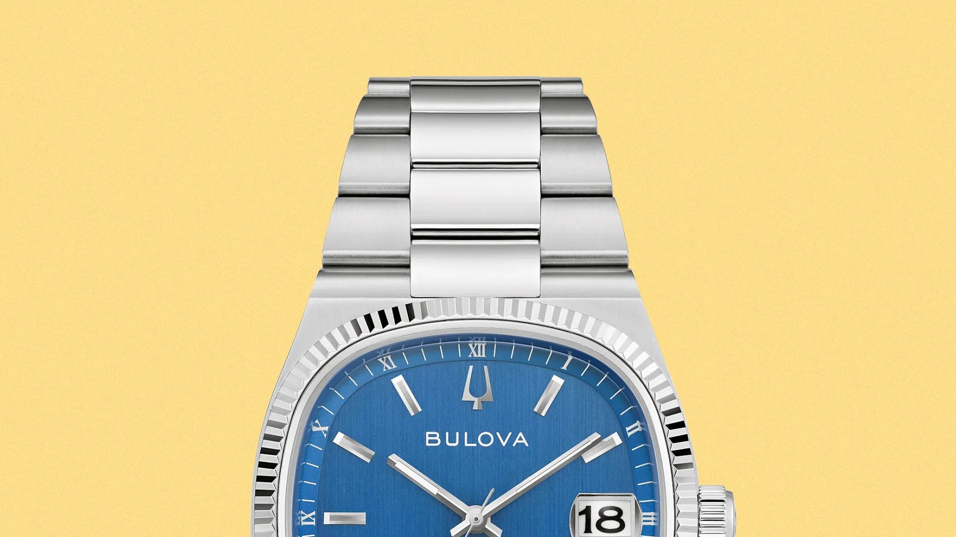 Silver Bulova wristwatch with a blue dial and date display on a yellow background.