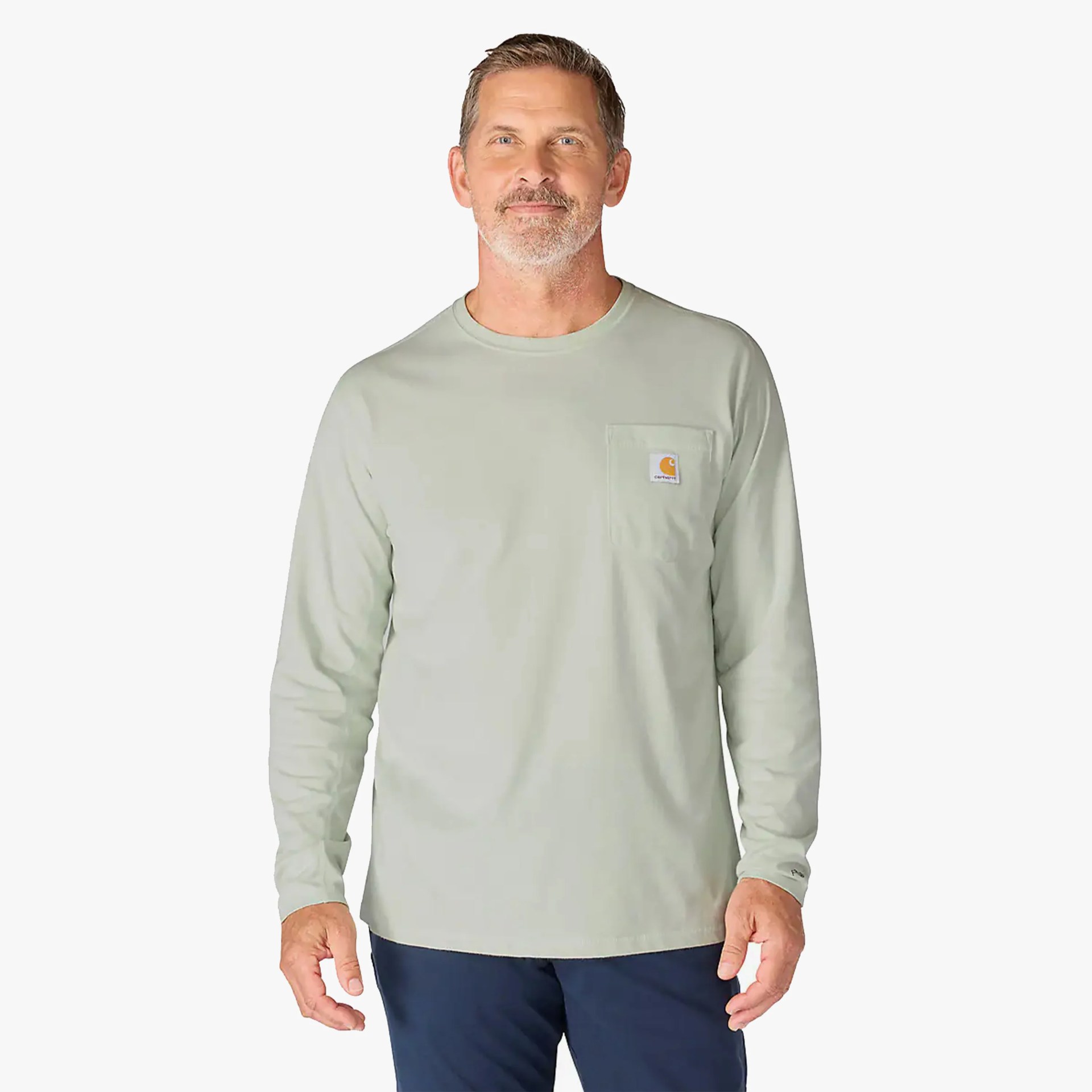 Light green long-sleeve Carhartt shirt with chest pocket and logo worn by a man.