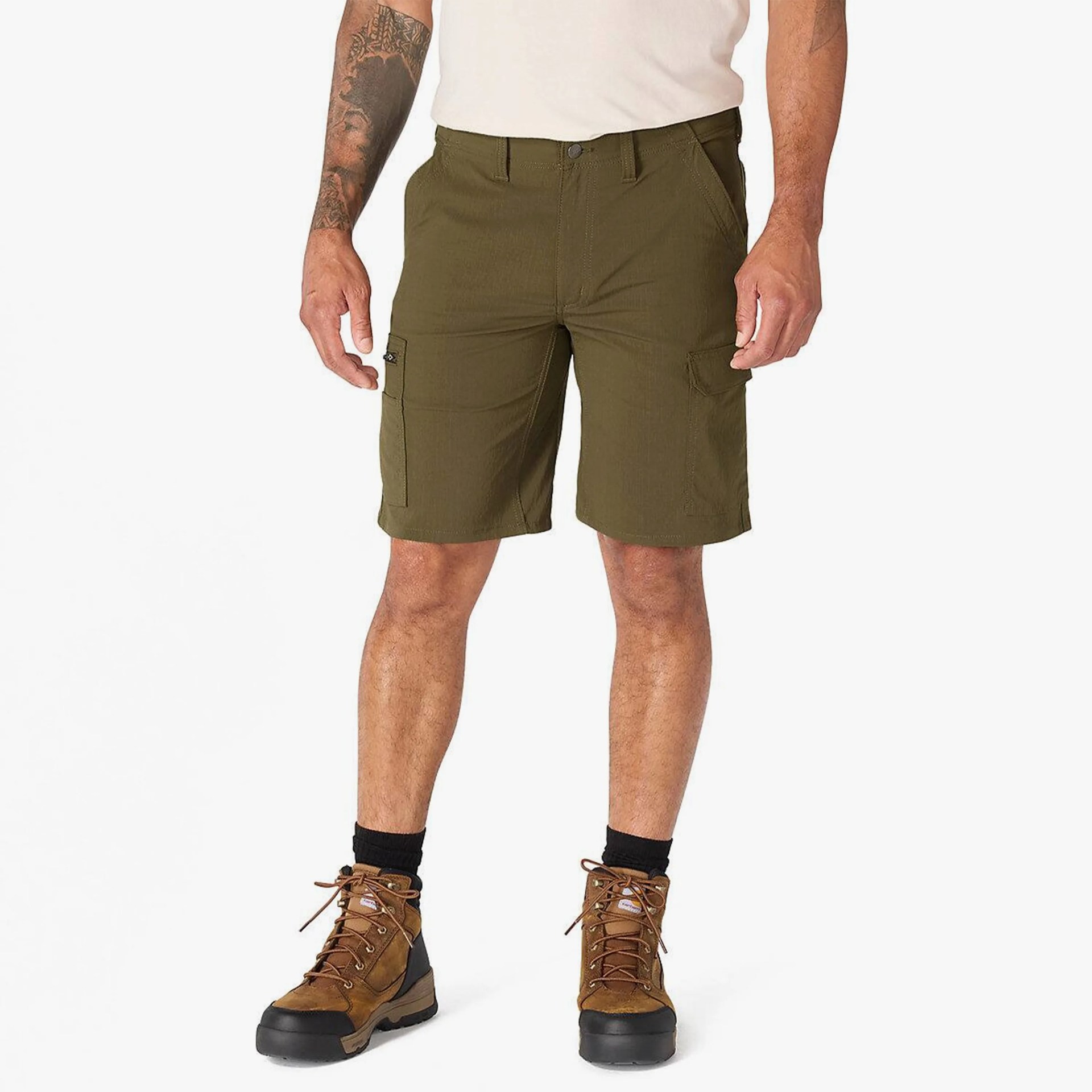 Olive green cargo shorts worn by a person with brown hiking boots and black socks.