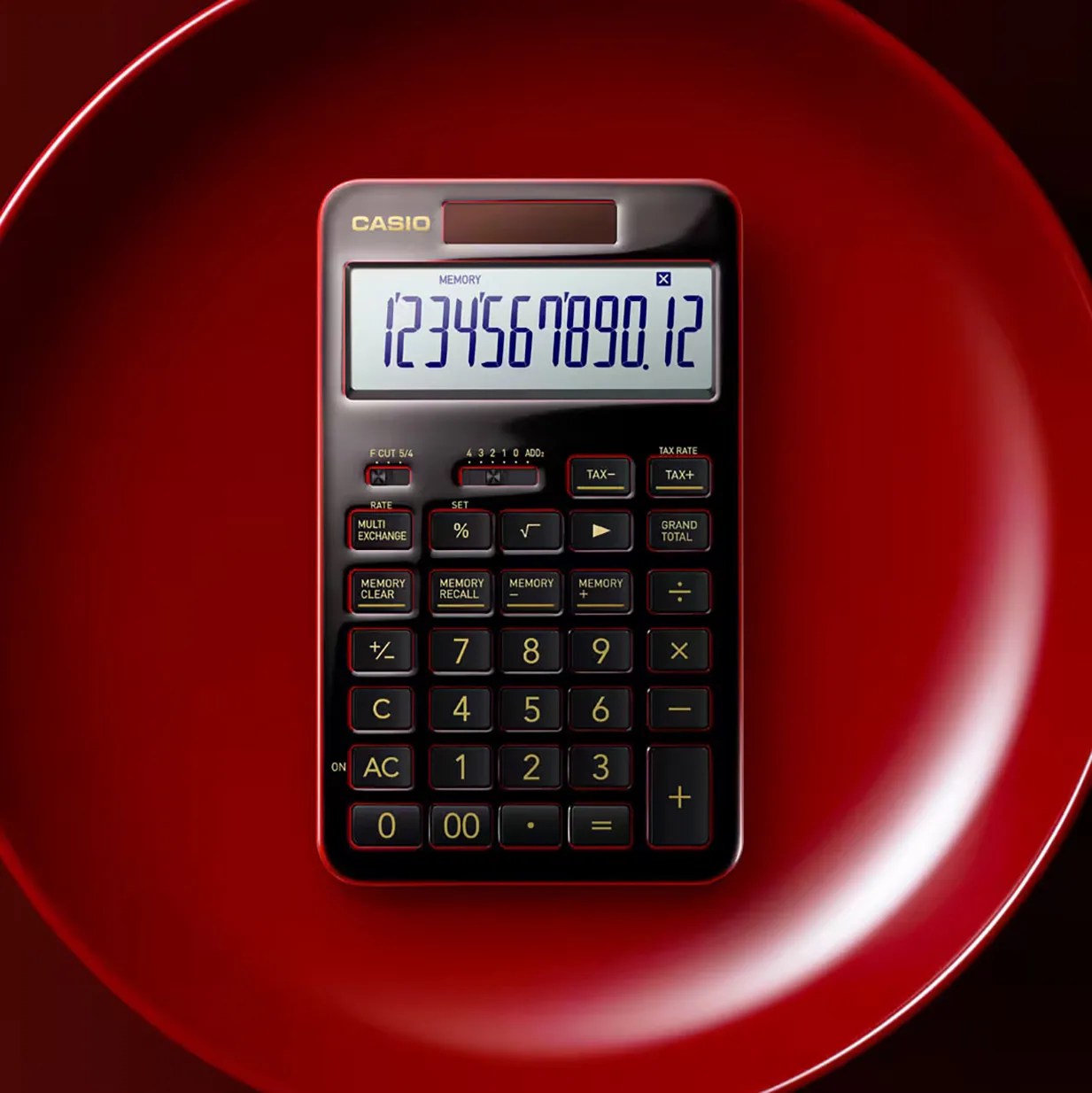 Black Casio calculator with yellow buttons and a digital display showing numbers on a red plate.