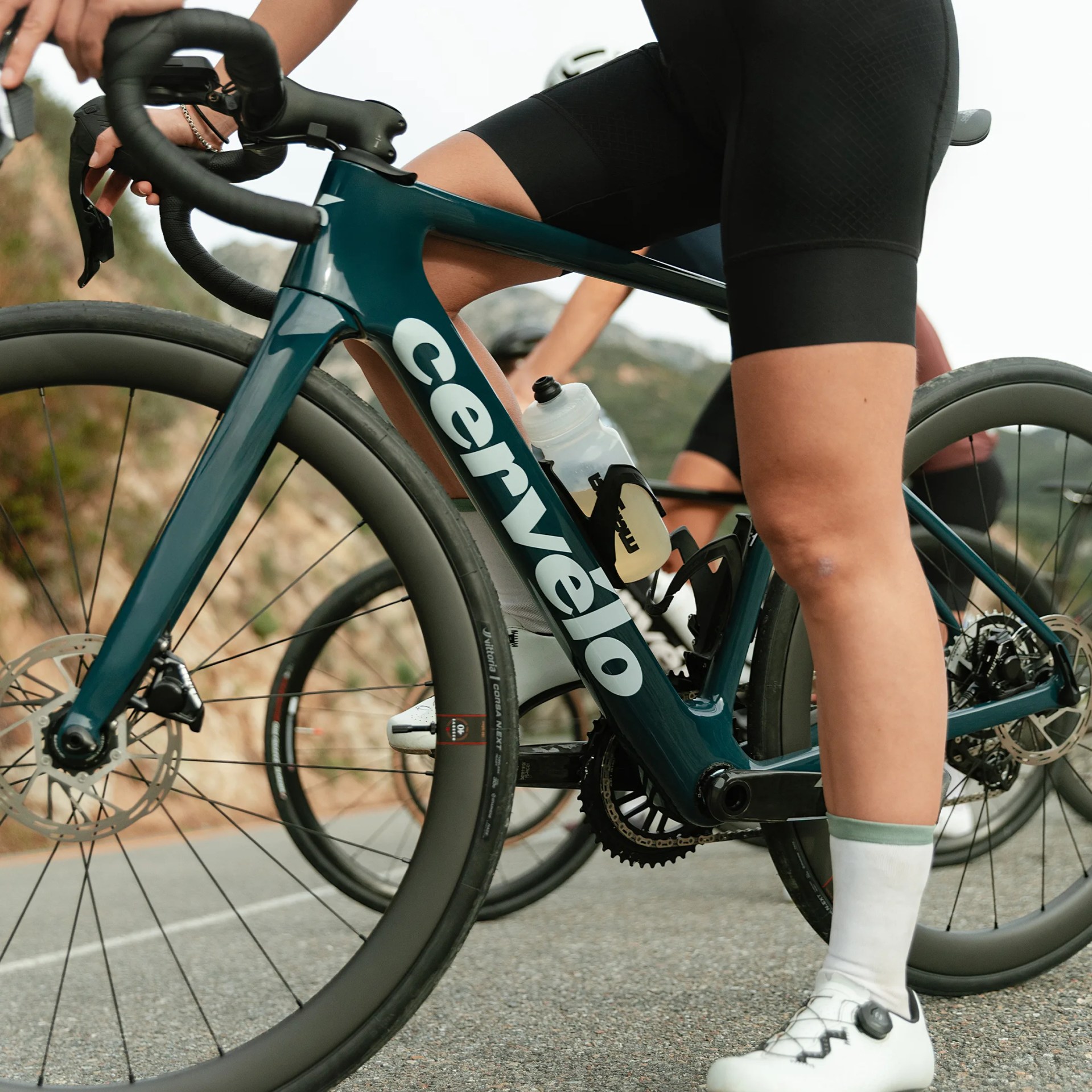 Teal Cerv&eacute;lo road bike with deep-section carbon wheels and a water bottle mounted on the frame.
