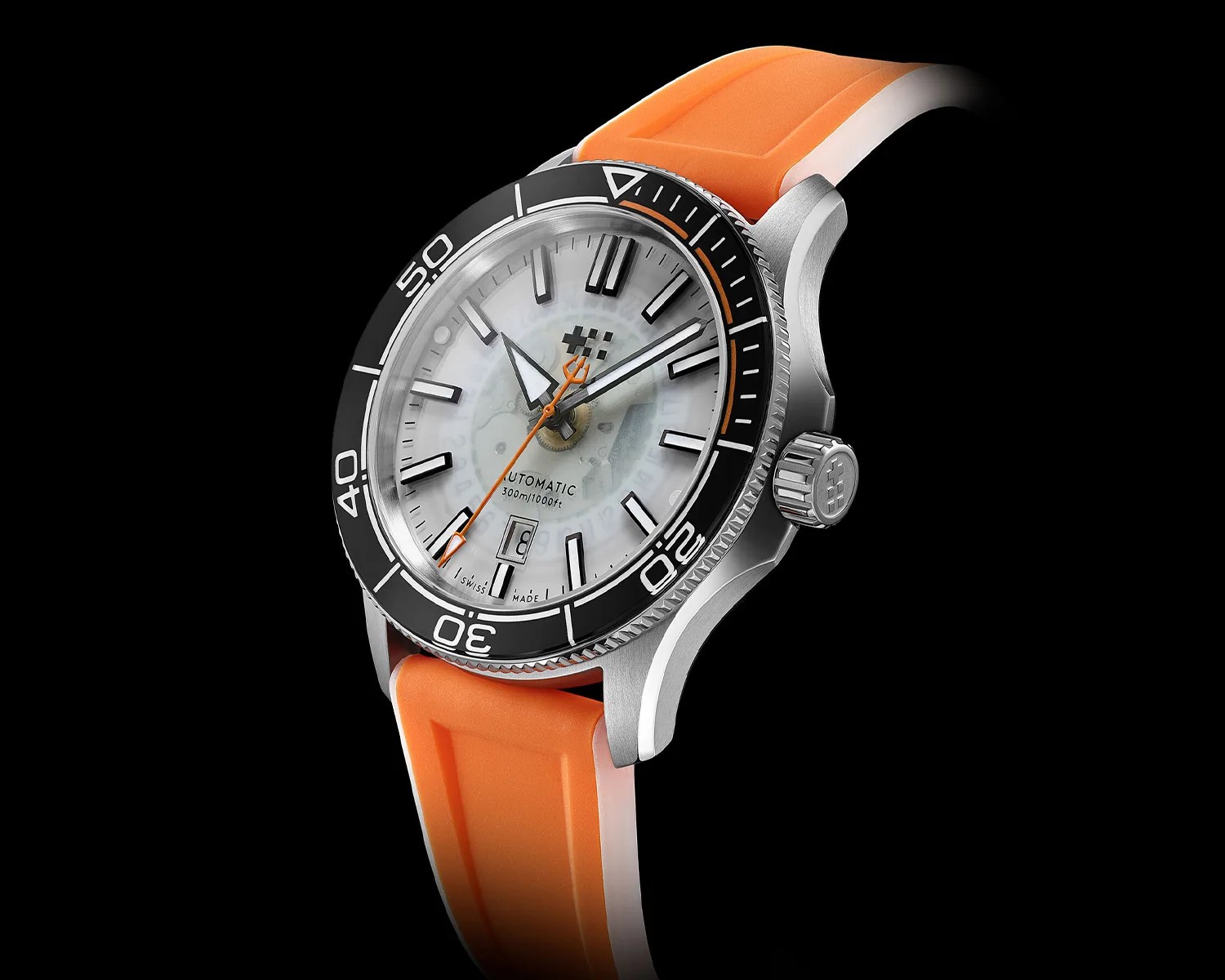 Diver-style watch with a black bezel, white dial, orange second hand, and orange rubber strap.