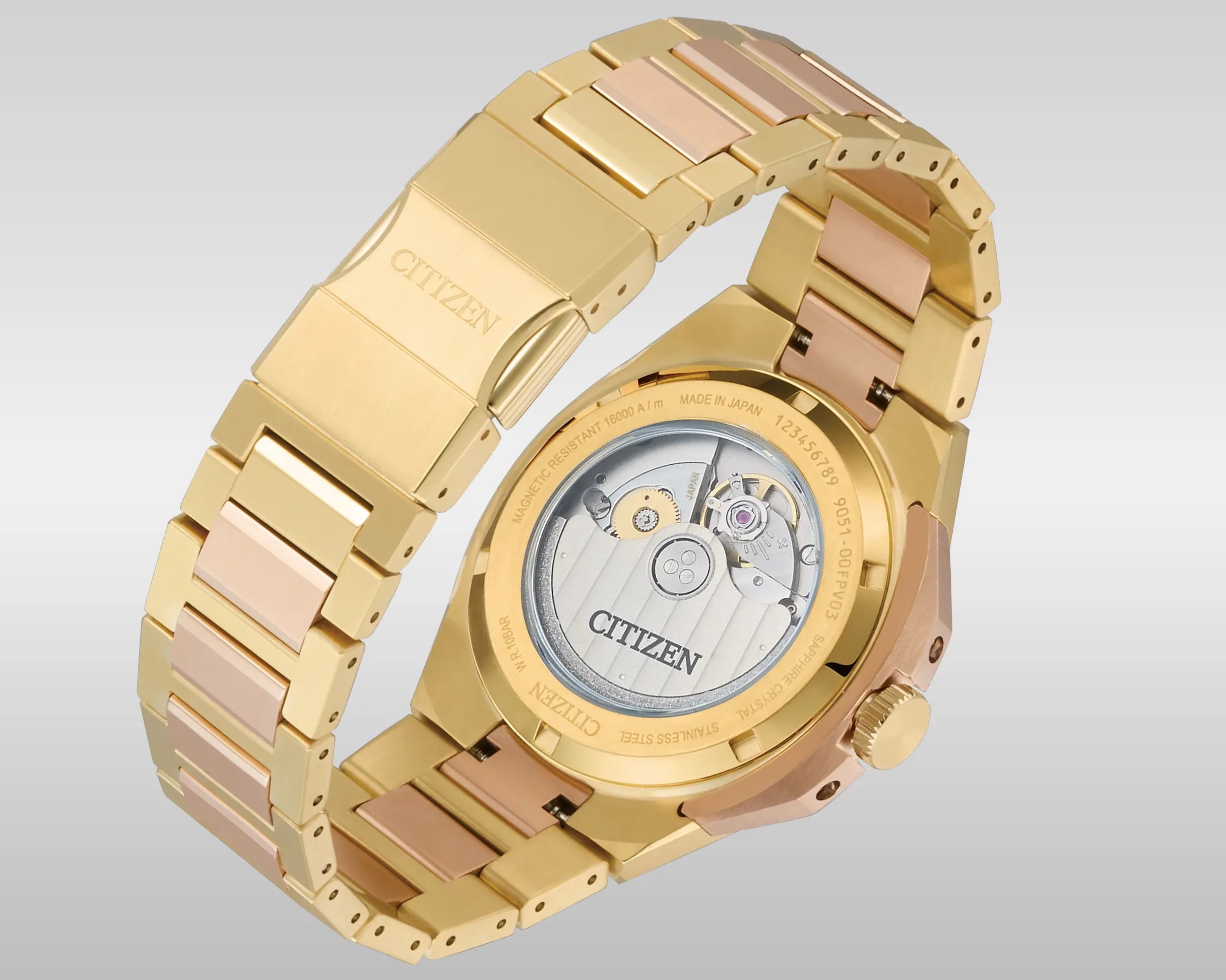 Gold and rose gold two-tone Citizen watch with visible mechanical movement through a transparent case back.
