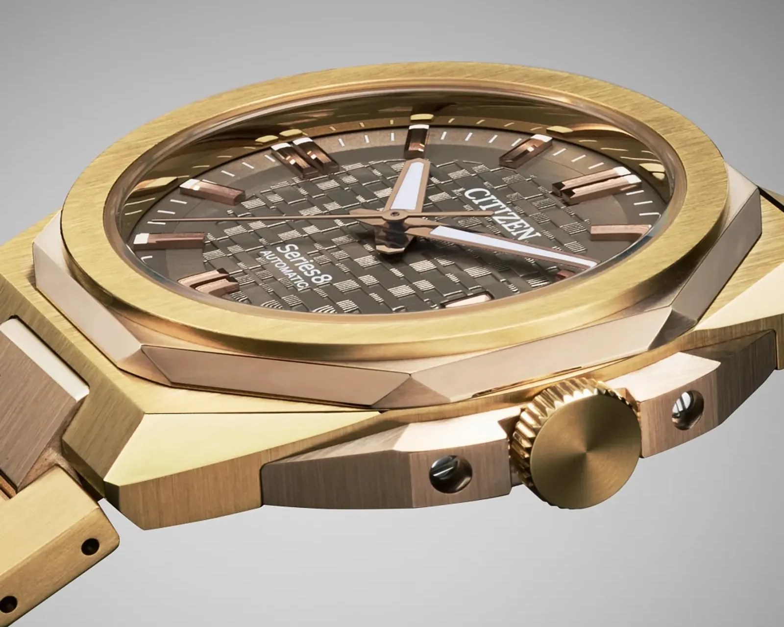 Gold-tone Citizen Series 8 automatic watch with textured brown dial and rose gold hour markers.