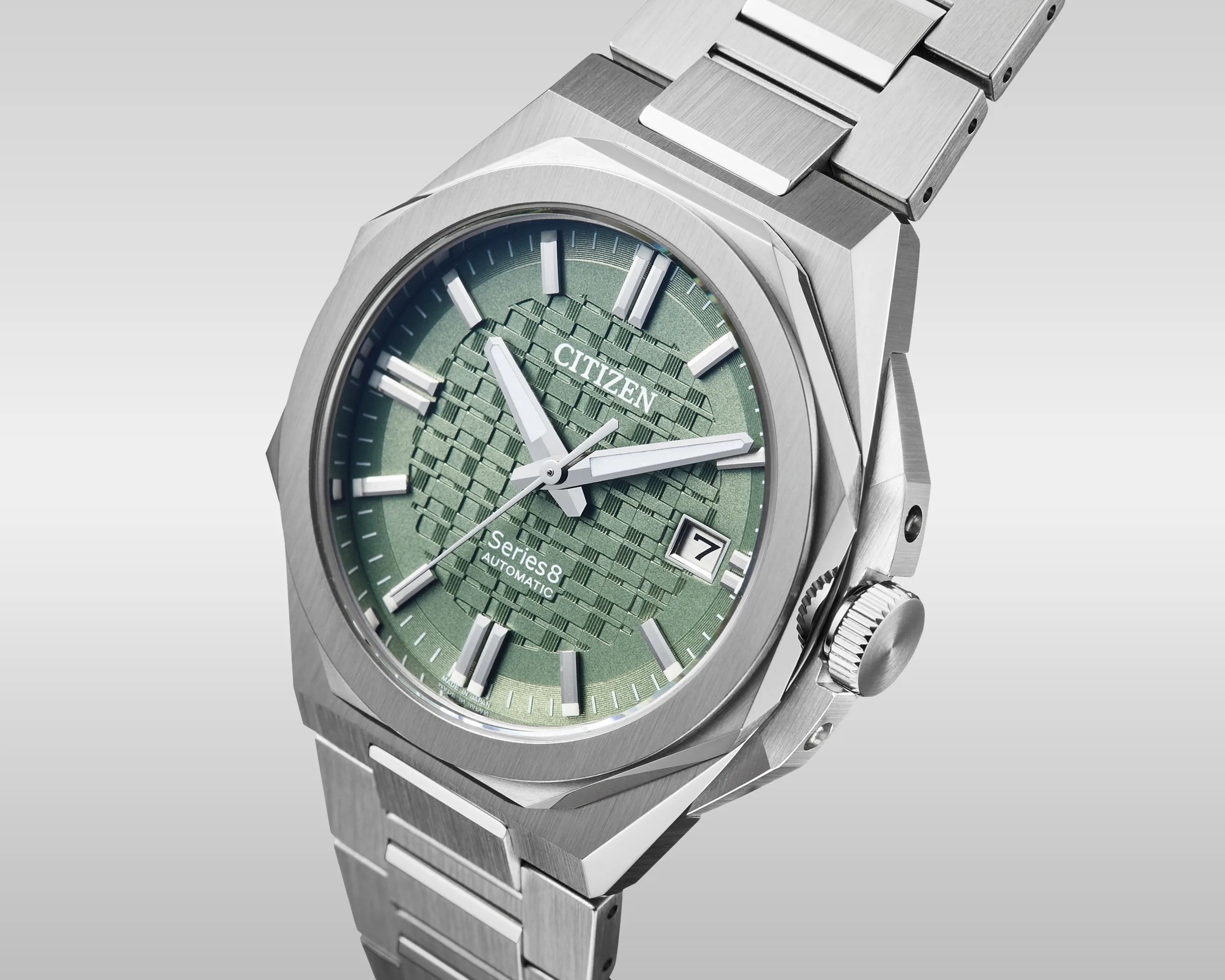 Stainless steel Citizen Series 8 automatic watch with textured green dial and date window at 3 o'clock.