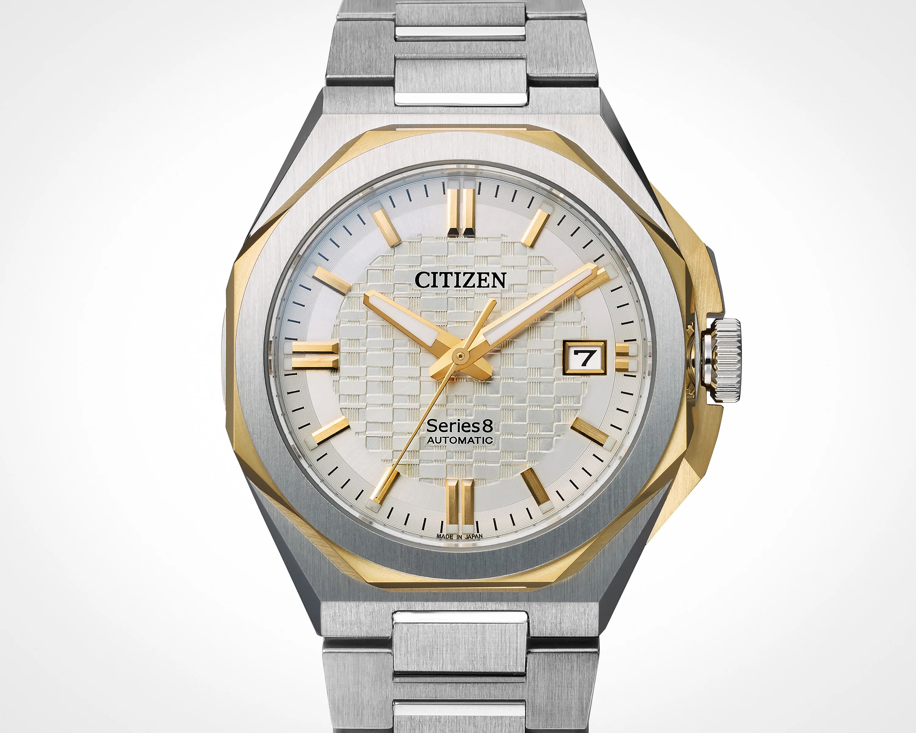 Silver and gold Citizen Series 8 automatic wristwatch with a textured white dial and date display.