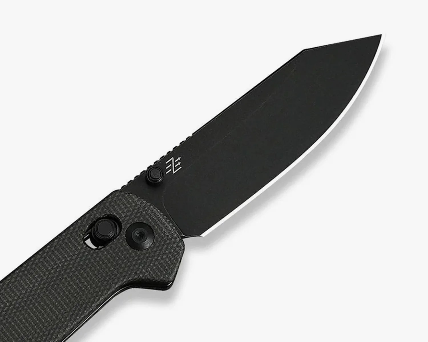Black folding knife with textured handle and partially serrated blade on a white background.