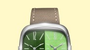 Watch with a square silver case, split green dial with white markers, and a beige leather strap.