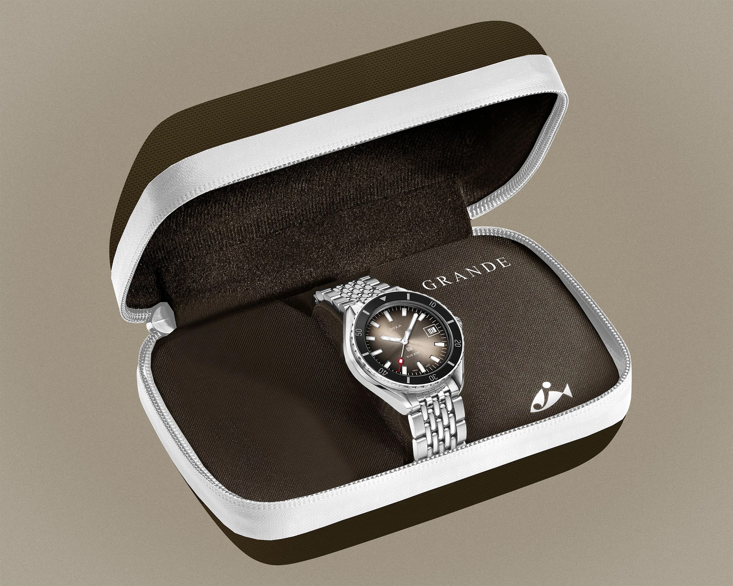 Silver metal wristwatch with black bezel and gradient brown dial in a brown and white zippered case.