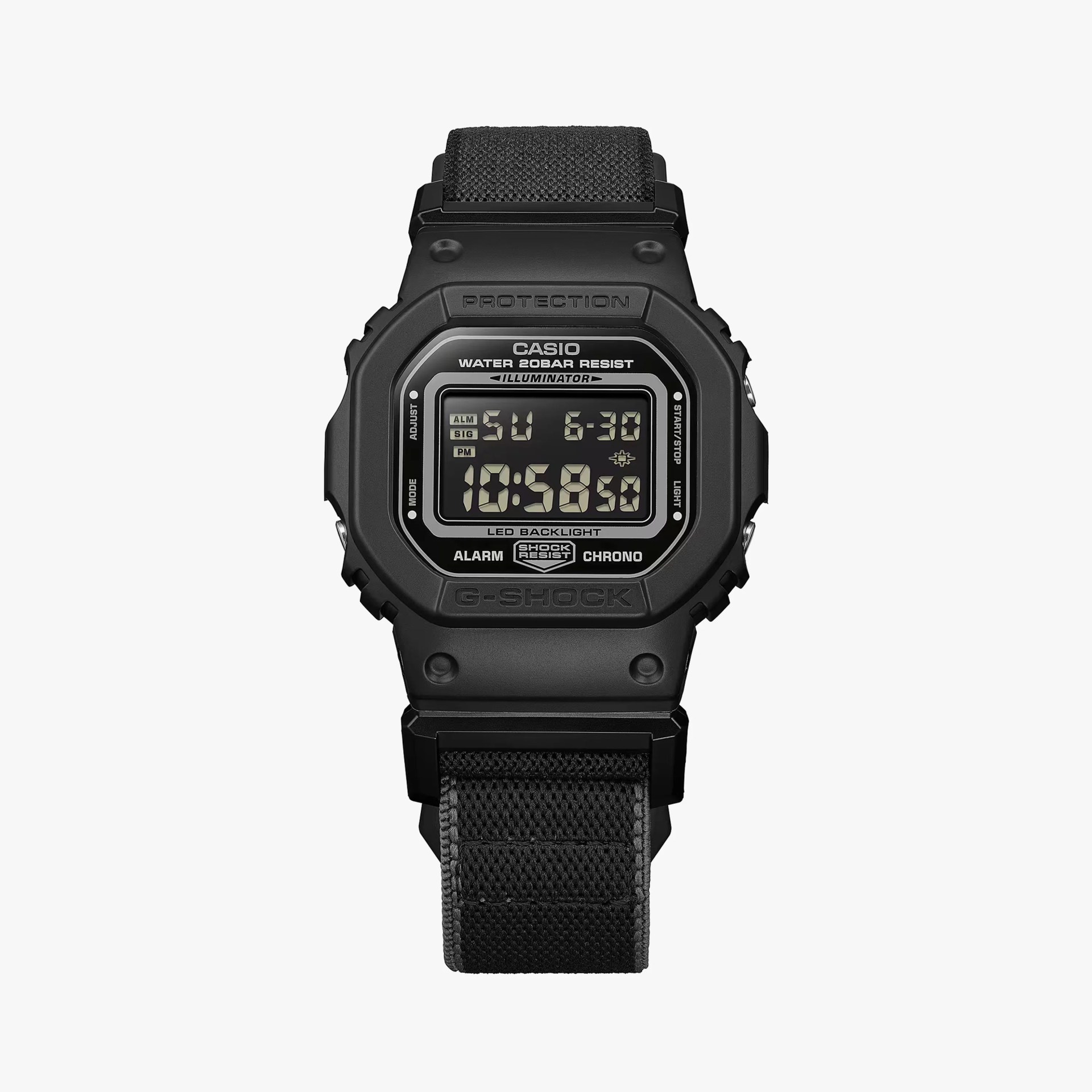 Black Casio G-Shock digital watch with fabric strap and rectangular display showing time and date.