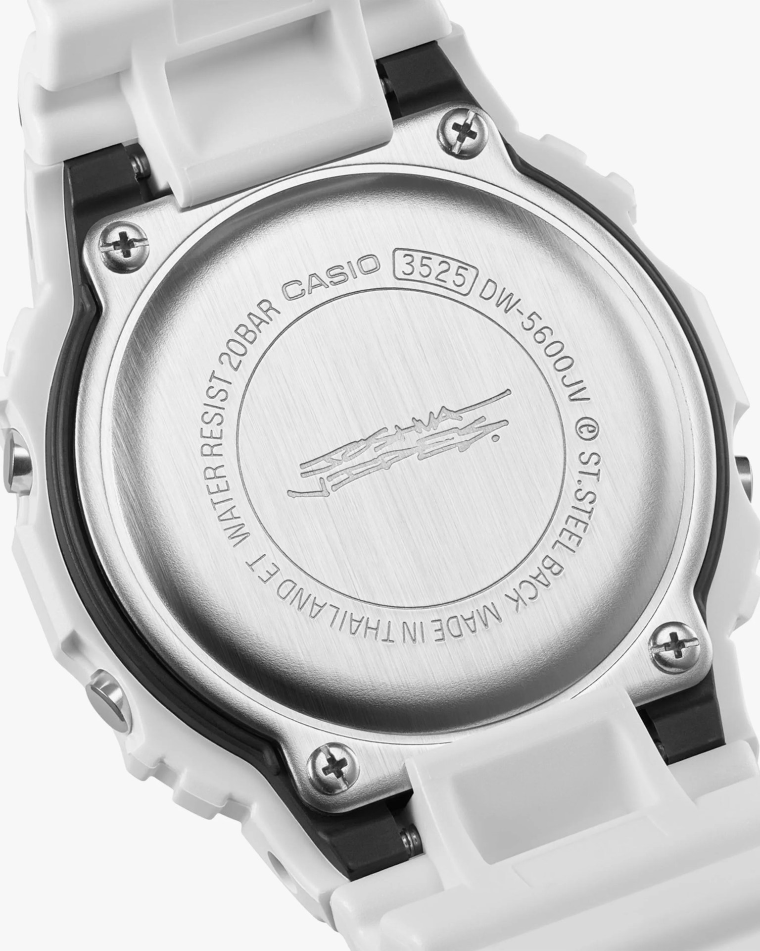 Stainless steel back of a white Casio DW-5600JV watch with engraved model and water resistance details.