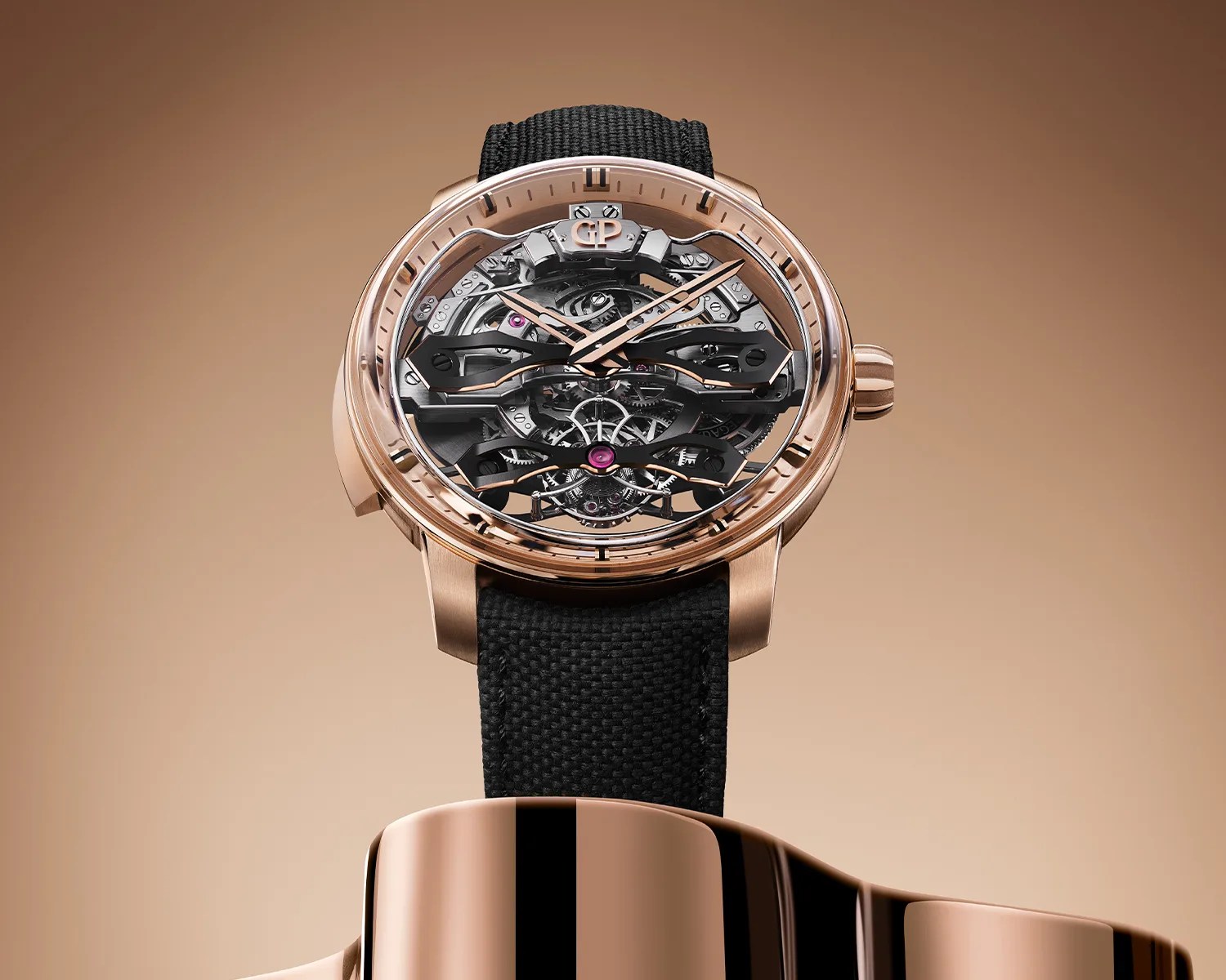 Rose gold skeleton watch with black fabric strap and visible mechanical gears.