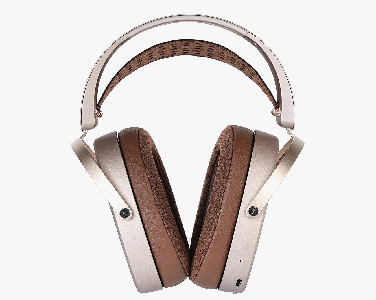 Over-ear headphones with brown cushioned ear pads and a metallic silver frame.