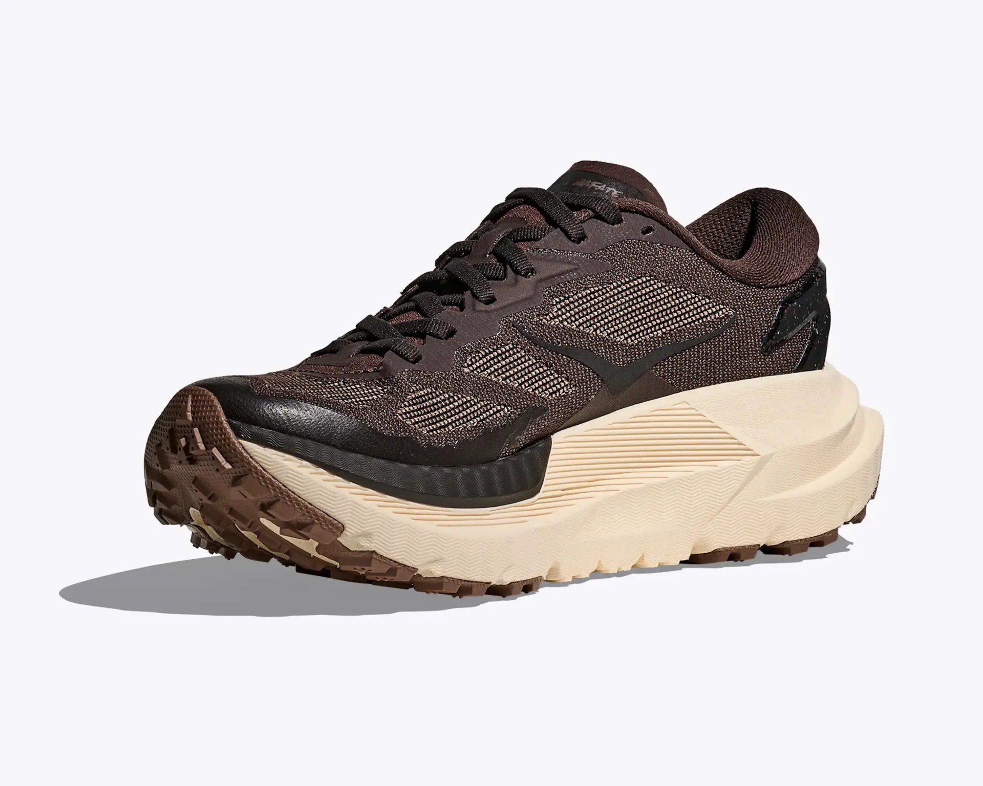 Brown and black mesh running shoe with thick beige sole and textured outsole.