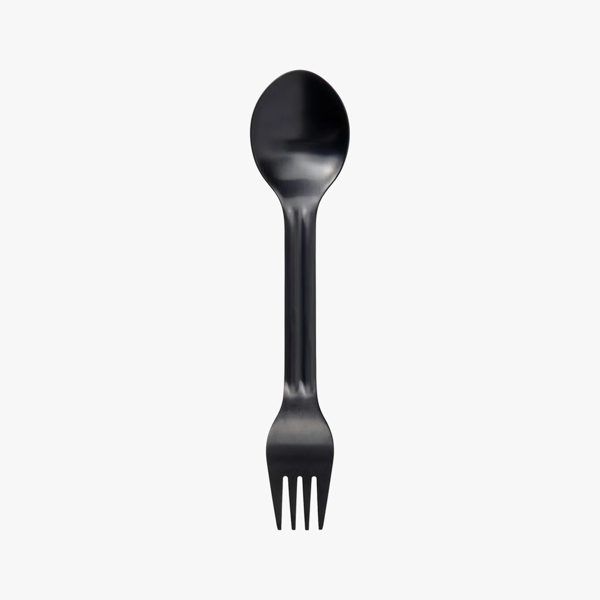 Black plastic spork with a spoon on one end and four fork tines on the other.