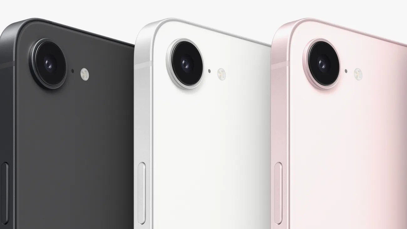 Three smartphones in black, white, and pink with single rear cameras and flash on a white background.