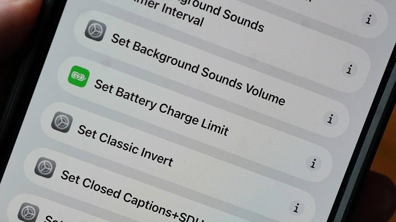 Smartphone screen showing settings options including "Set Background Sounds Volume," "Set Battery Charge Limit," "Set Classic Invert," and "Set Closed Captions+SDH.