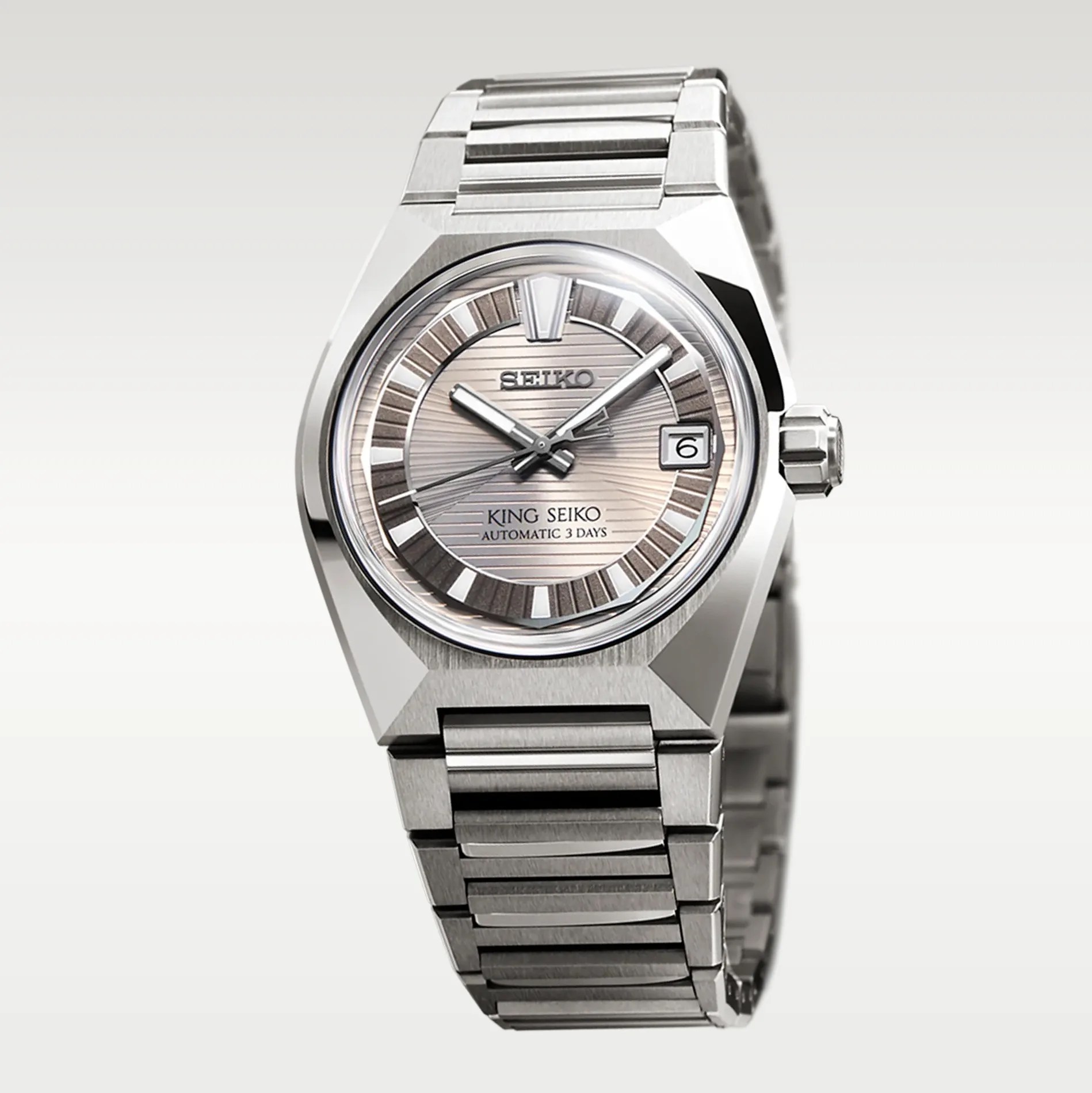 Silver stainless steel King Seiko automatic wristwatch with a textured dial and date window at 3 o'clock.
