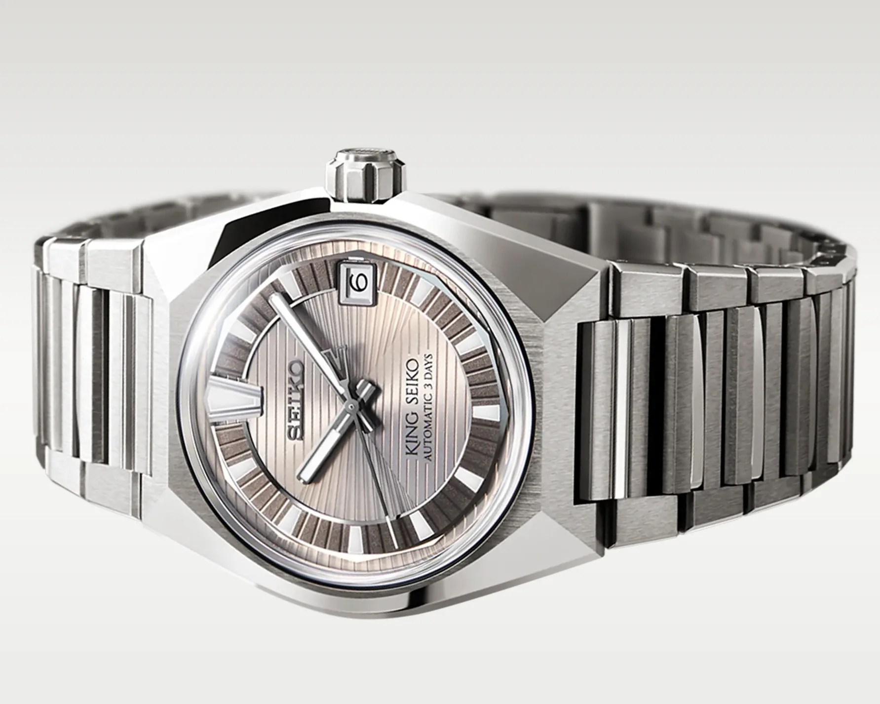 Silver stainless steel King Seiko automatic wristwatch with a textured dial and date window at 12 o'clock.