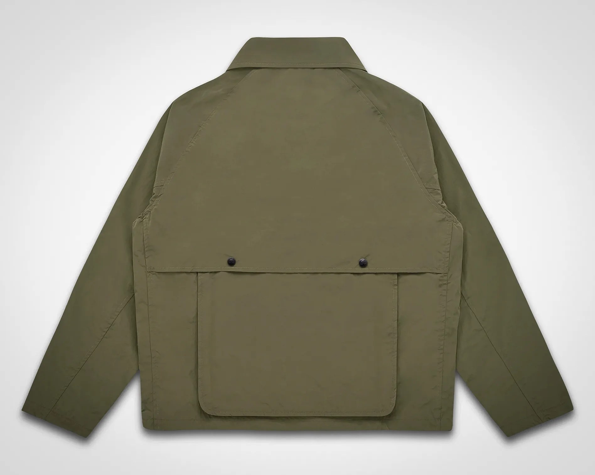 Olive green jacket with long sleeves and a large flap pocket on the back.