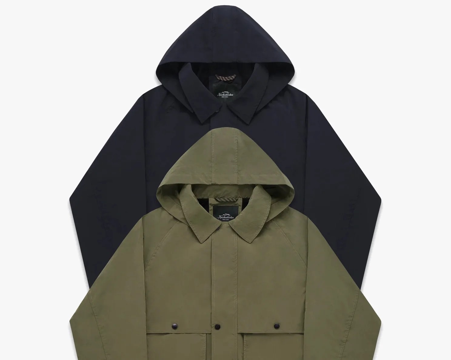 Two hooded jackets, one olive green with front pockets and one black, layered on a white background.