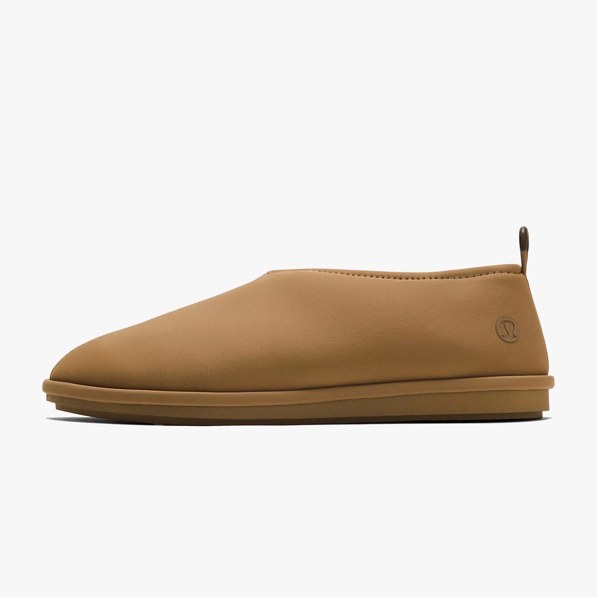 Light brown slip-on shoe with a smooth upper and a small pull tab at the heel.