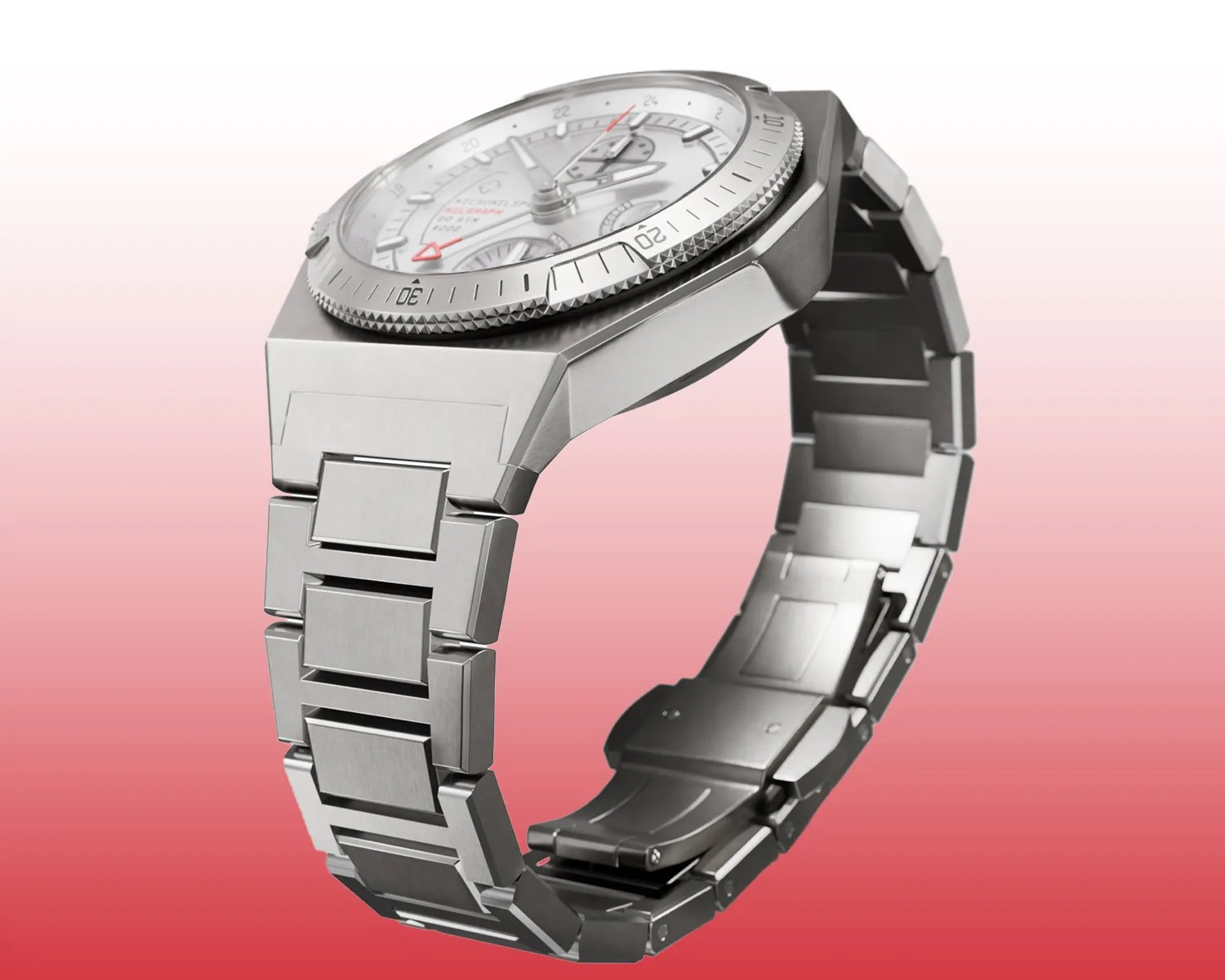 Silver titanium wristwatch with a brushed metal link bracelet and a detailed bezel on a gradient red background.