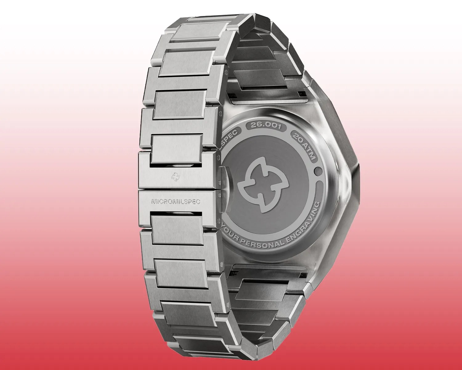 Brushed titanium watch band and case back with engraved logo and text on a gradient red background.