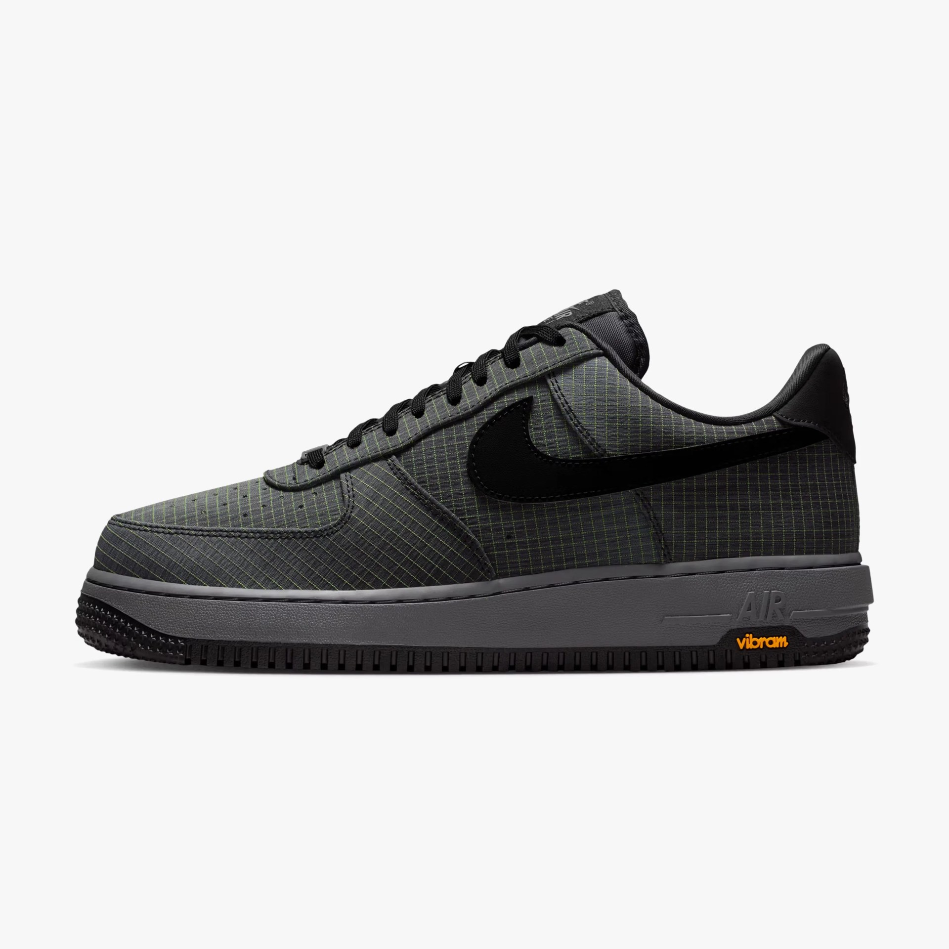 Low-top Nike Air Force 1 sneaker in dark gray with black swoosh and Vibram sole.