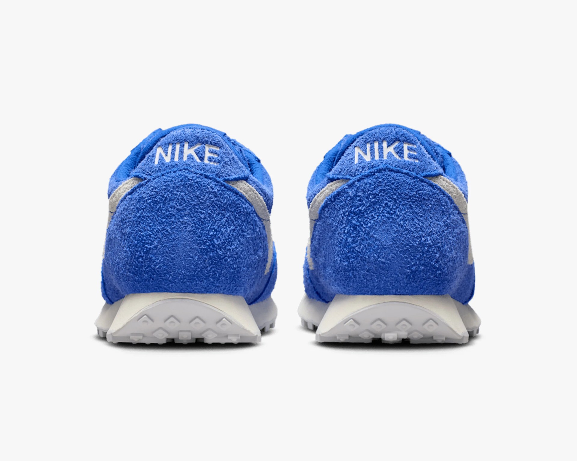 Pair of blue Nike sneakers with white soles shown from the back.