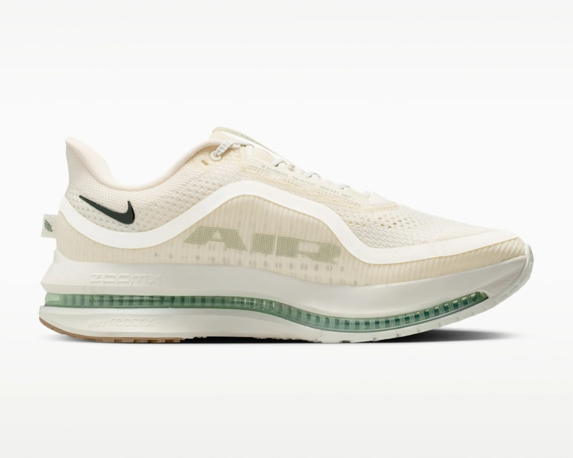 Cream-colored Nike Air Zoom running shoe with translucent midsole and black Nike swoosh on heel.
