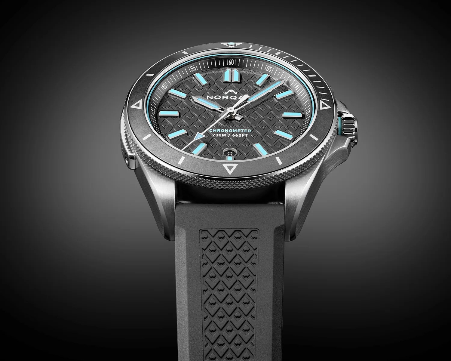 Black and silver NORQAIN chronometer watch with blue luminescent markers and textured black rubber strap.