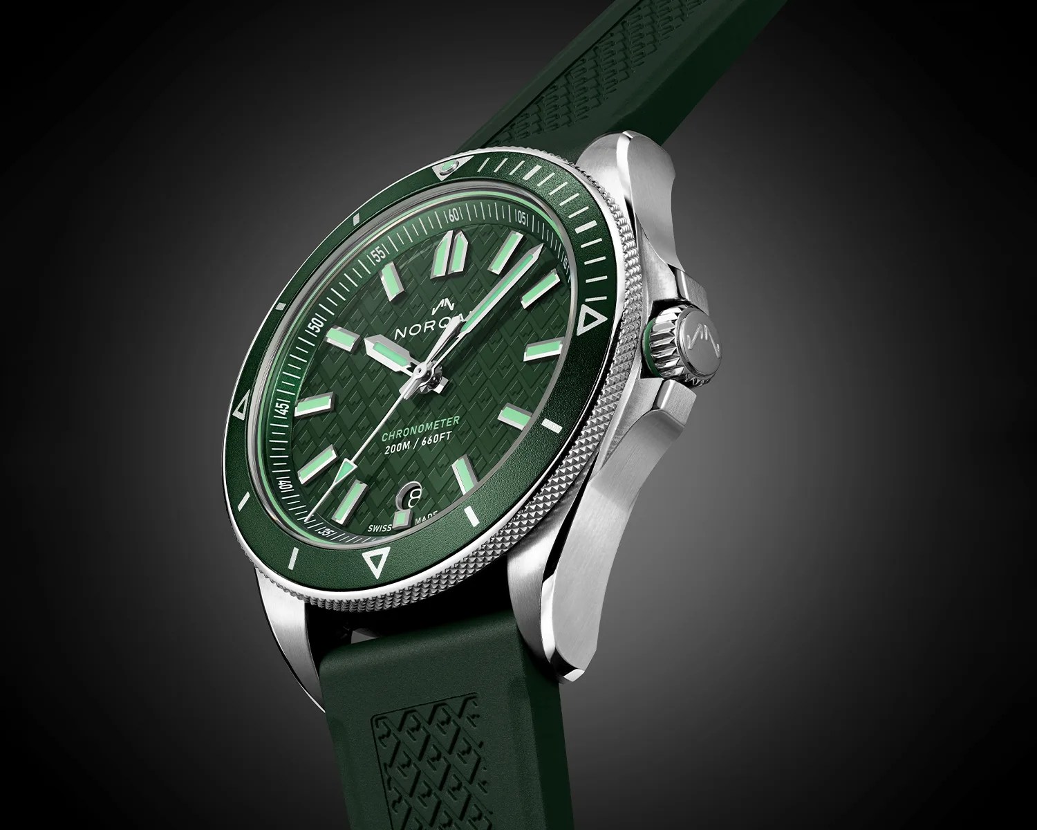 Green dial and bezel stainless steel NORQAIN chronometer watch with green rubber strap.