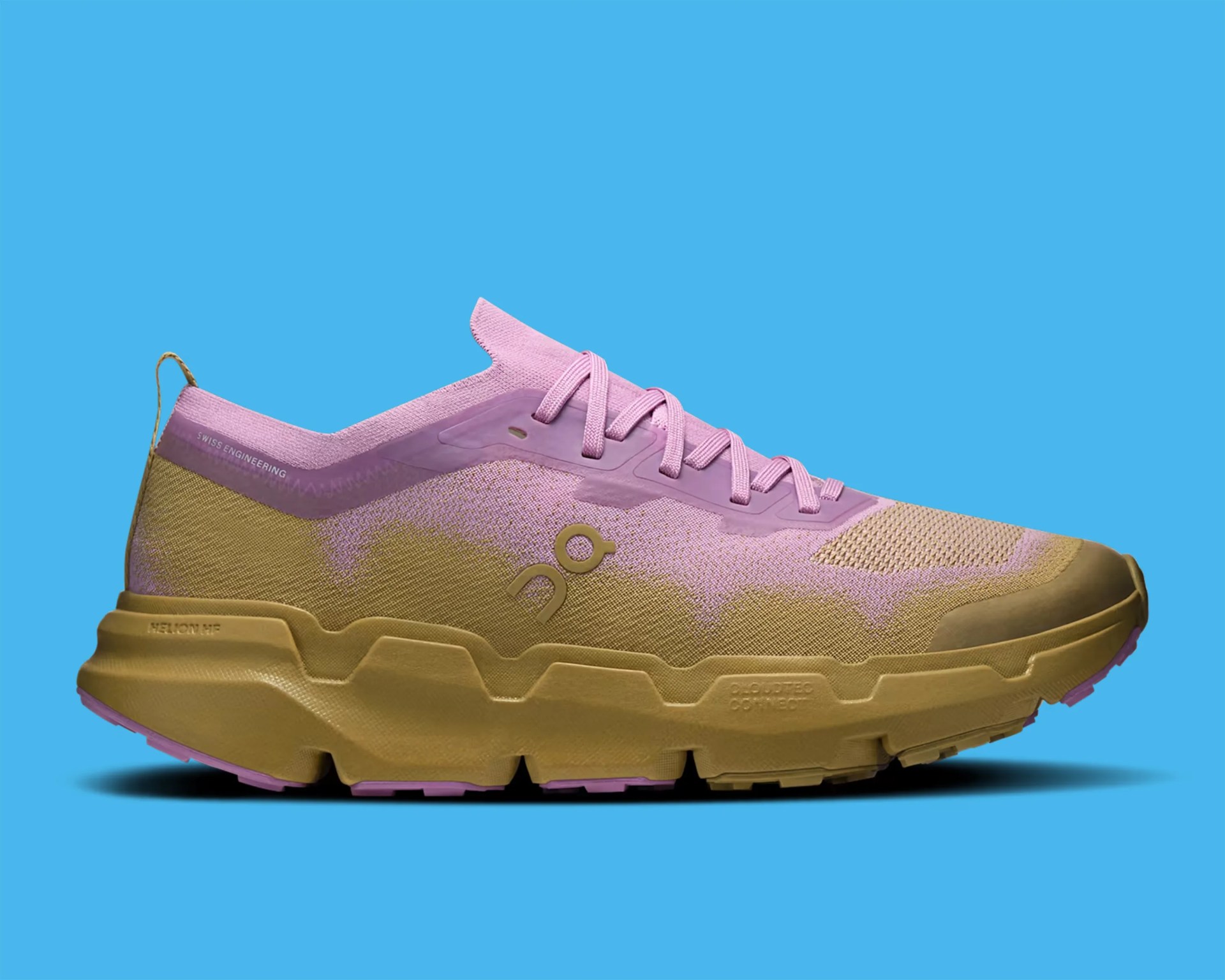 Light purple and tan athletic shoe with thick tan sole and laces on blue background.