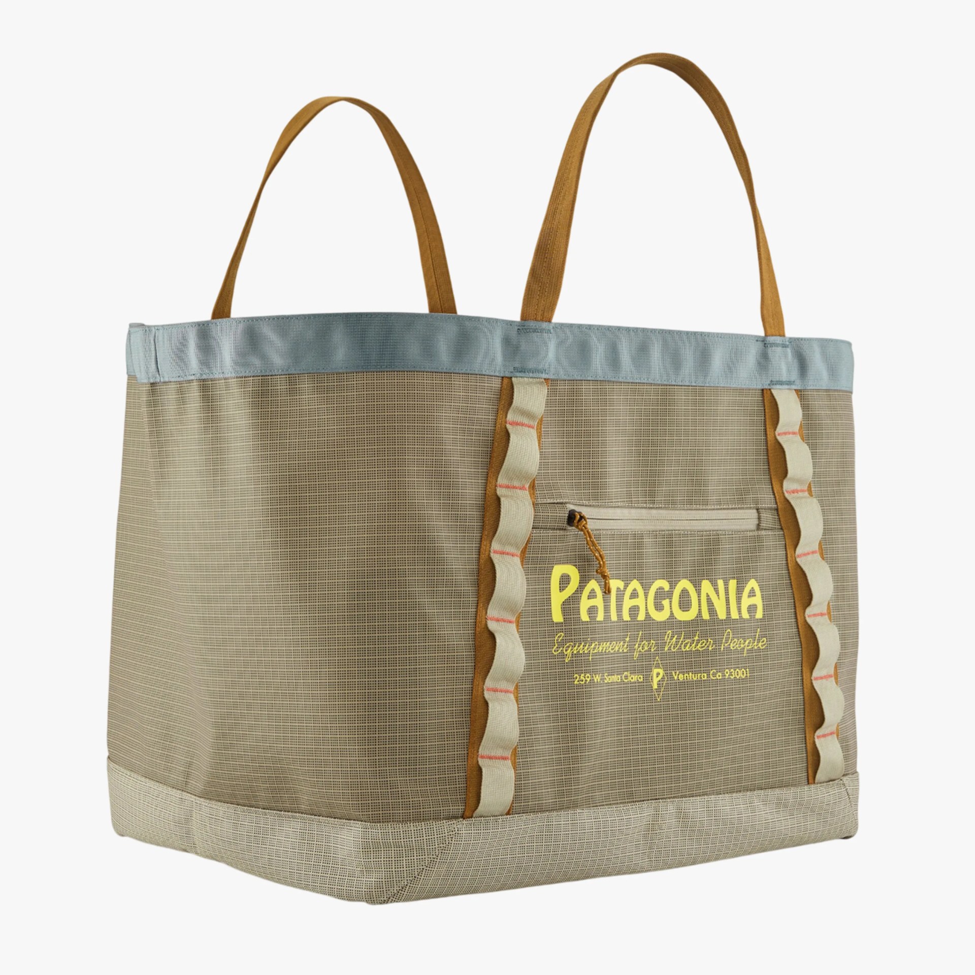 Beige and light blue Patagonia tote bag with brown handles and yellow logo text on front pocket.