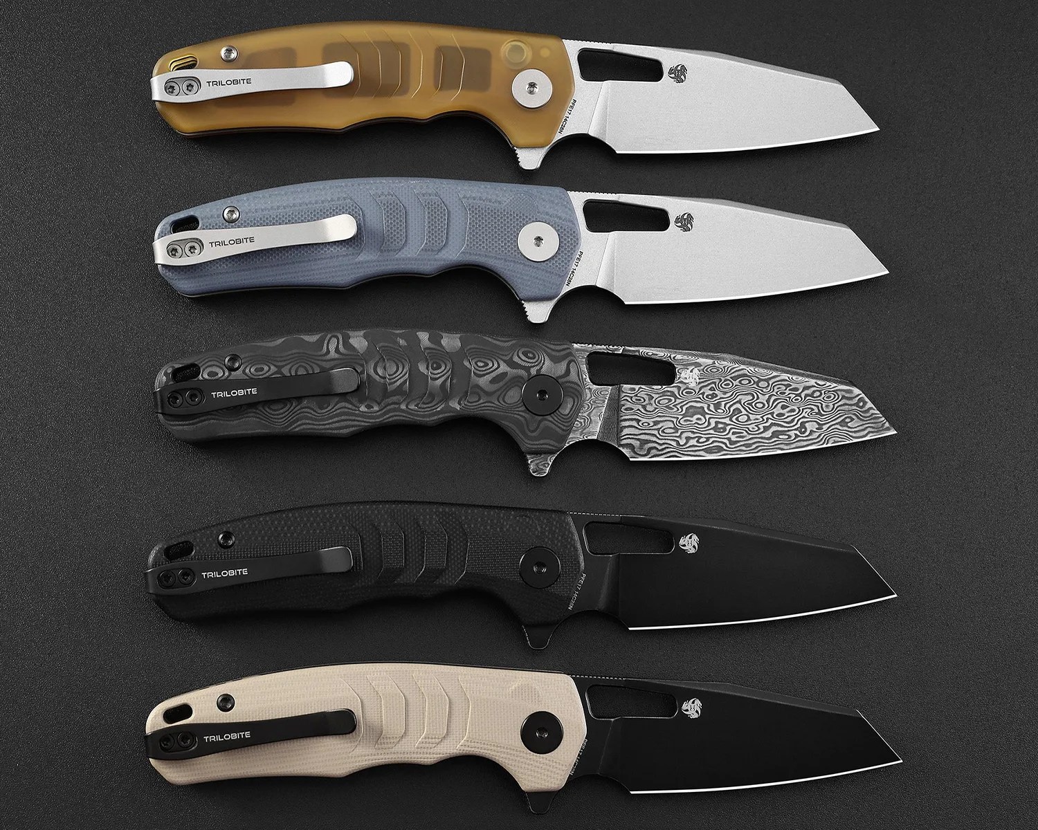 Five folding knives with different handle colors and blade finishes arranged vertically on a black surface.