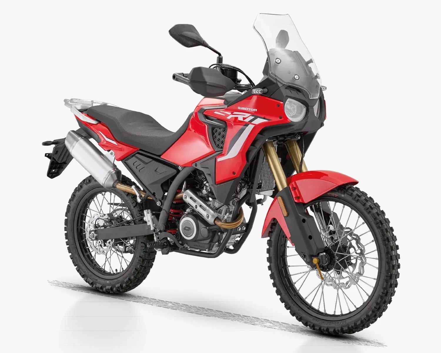 Red and black off-road adventure motorcycle with knobby tires and a tall windshield.