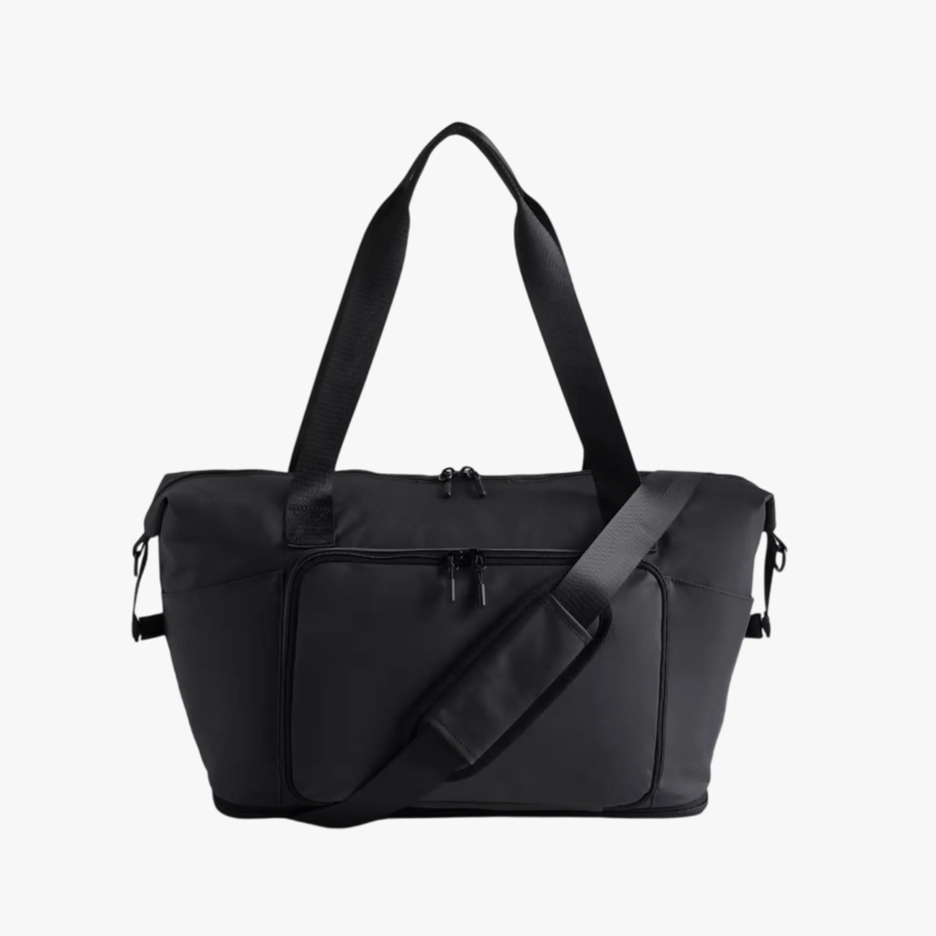 Black rectangular duffel bag with dual handles, front zippered pocket, and adjustable shoulder strap.