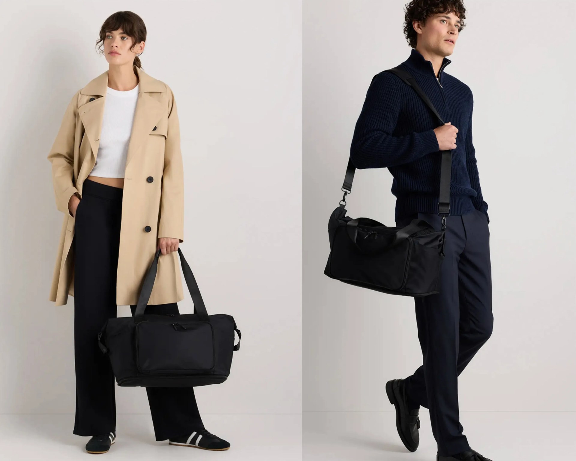 Two people each holding a black rectangular duffel bag with shoulder straps, one worn crossbody and one carried by hand.