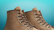 Pair of tan suede lace-up boots with metal eyelets against a blue gradient background.