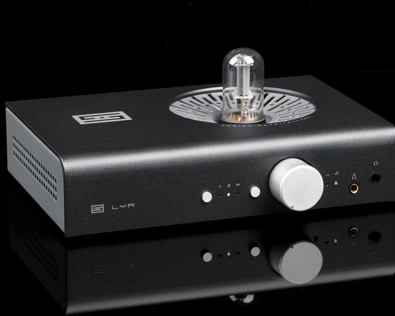 Black Schiit Lyr headphone amplifier with a visible vacuum tube and silver control knobs on a reflective black surface.