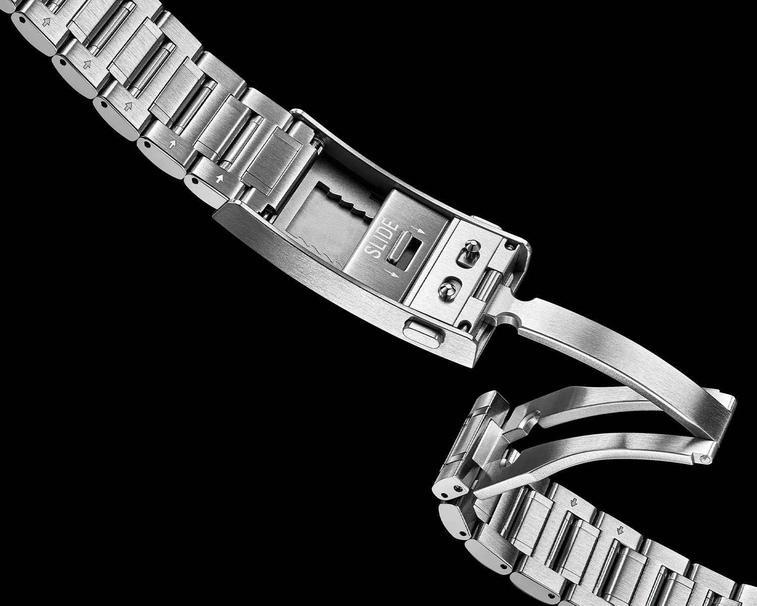 Stainless steel watch bracelet with a butterfly clasp mechanism open, showing the "SLIDE" adjustment feature.
