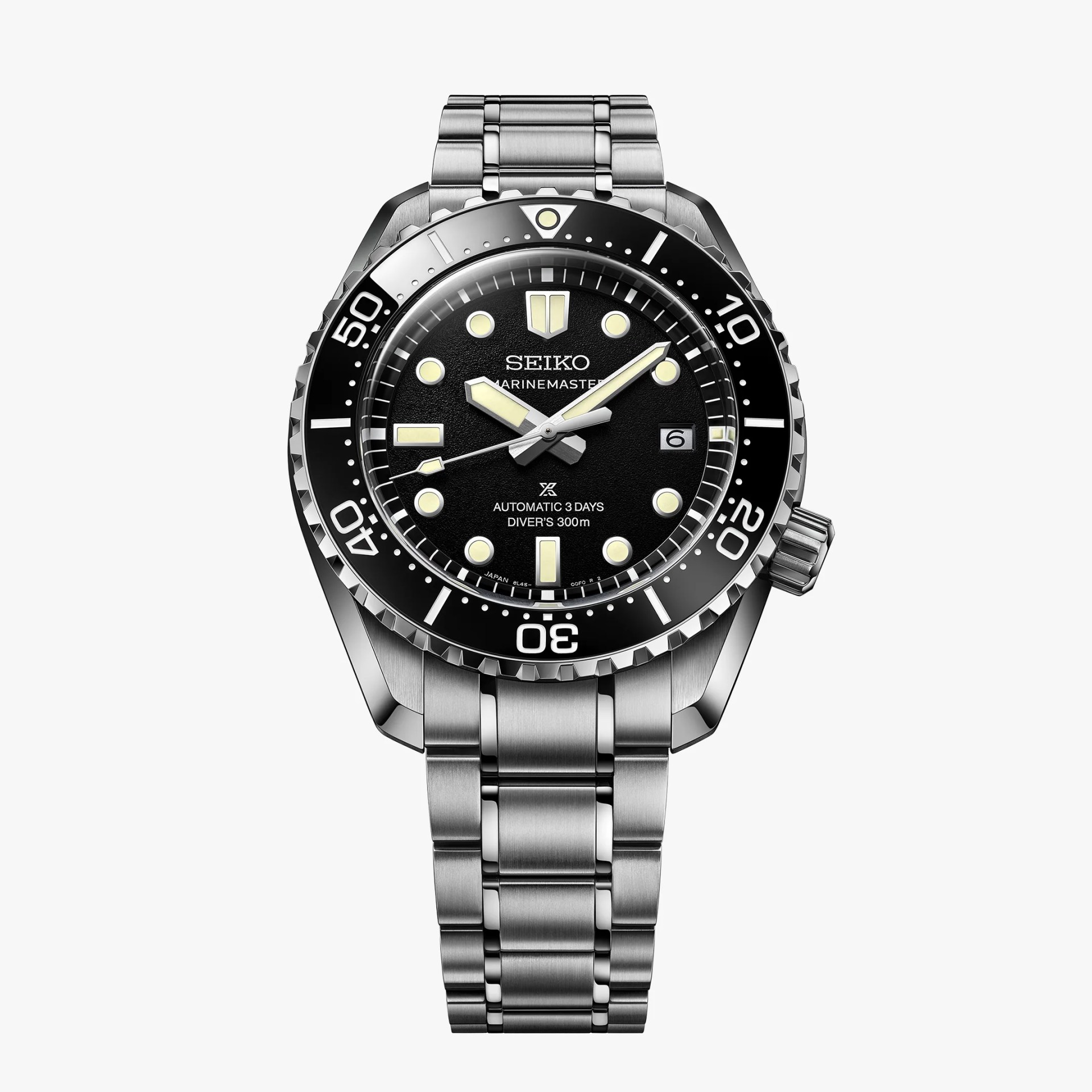 Seiko Marinemaster stainless steel dive watch with black bezel and dial, luminous markers, and date display.