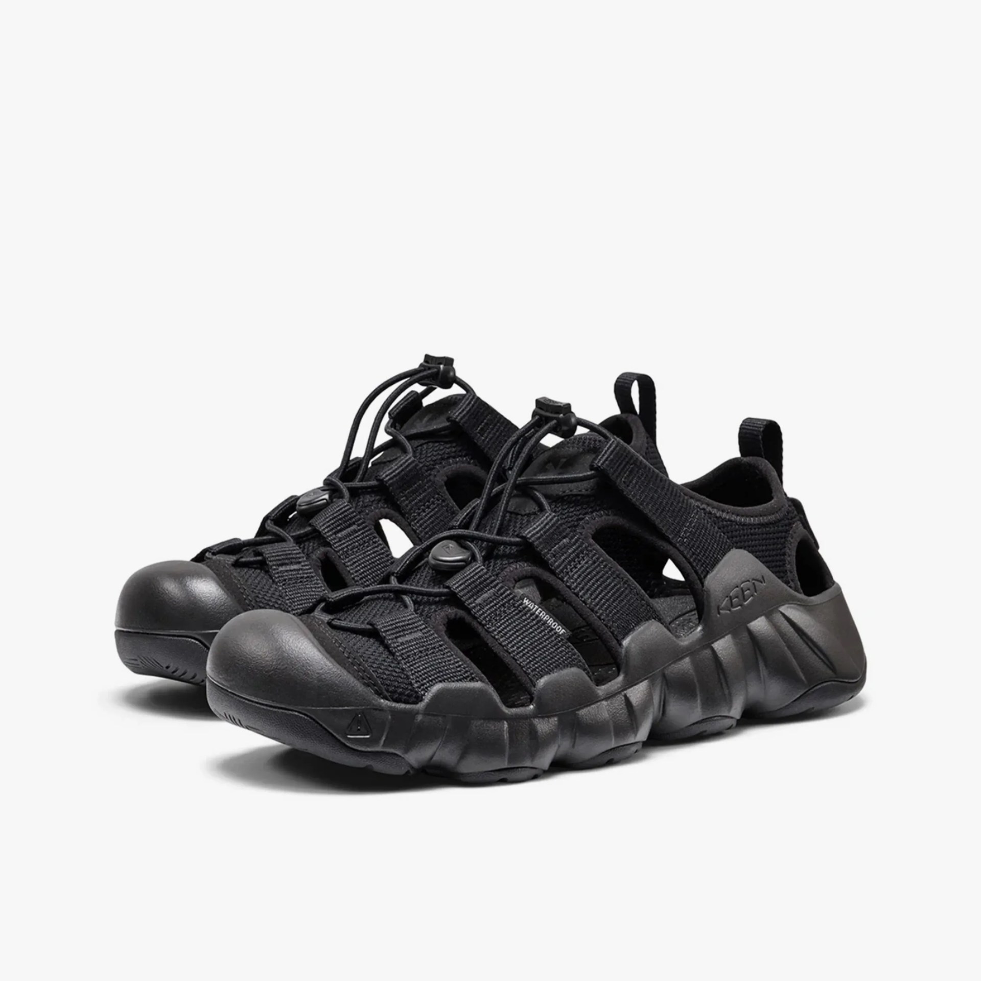 Pair of black waterproof KEEN sandals with closed toes and adjustable bungee laces.