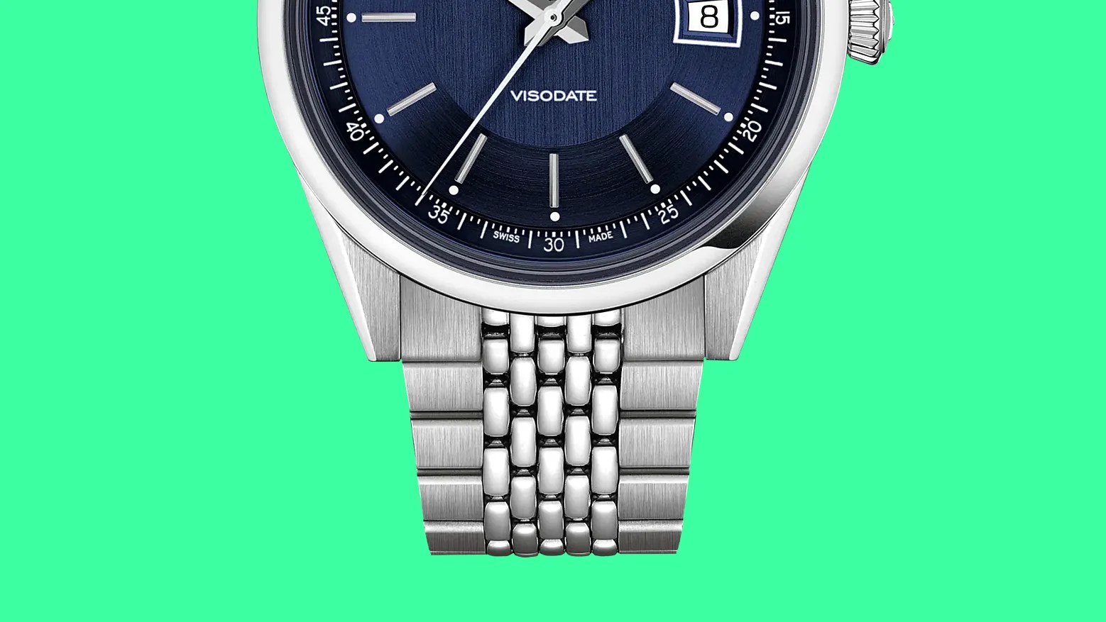 Close-up of a silver metal watch band attached to a blue dial watch with "VISODATE" text.