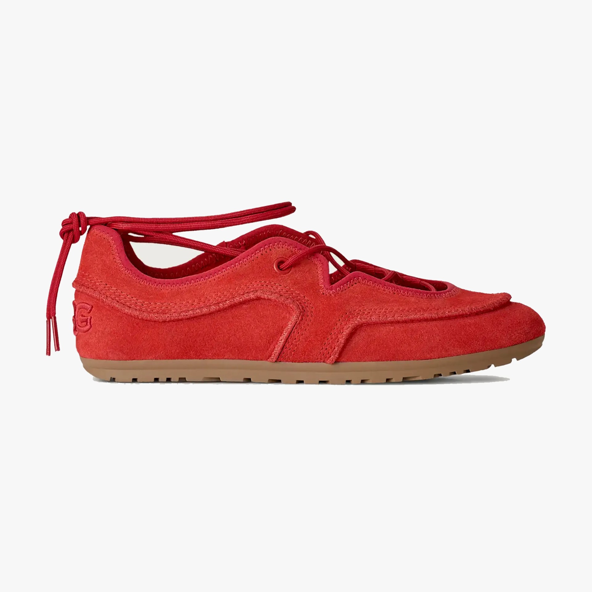 Red suede sneaker with gum sole and red lace-up ankle ties, side view.